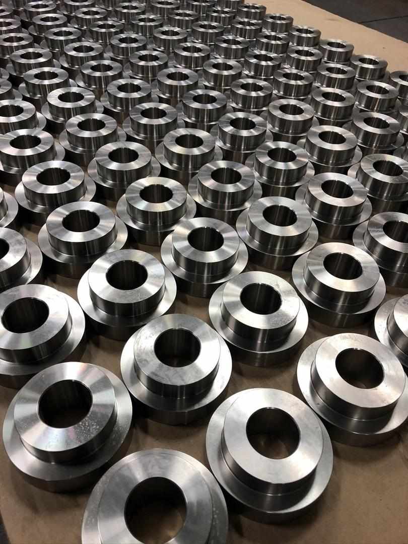 High-volume production run of machined steel bushings